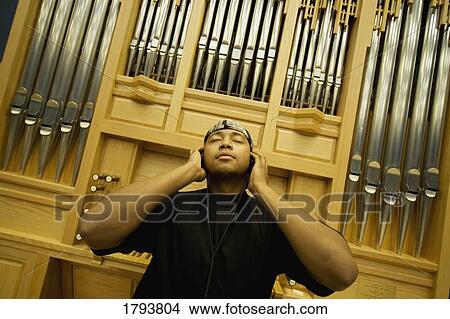 Picture - Man listening to music. Fotosearch