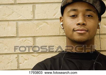 Stock Image - Man listening to music. Fotosearch