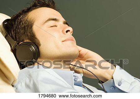Man listening to music View Large Photo Image Stock Image - Man listening to music. Fotosearch