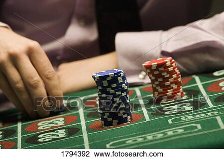 Stock Image - Man playing roulette. Fotosearch