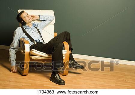 Stock Image - Man relaxing after work. Fotosearch