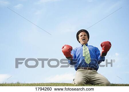 Stock Image - Man shouting victory. Fotosearch