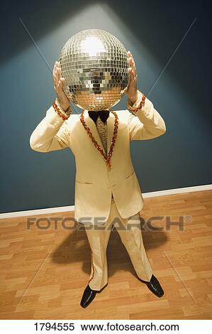 Man with disco ball View Large Photo Image Stock Photography - Man with disco ball. Fotosearch