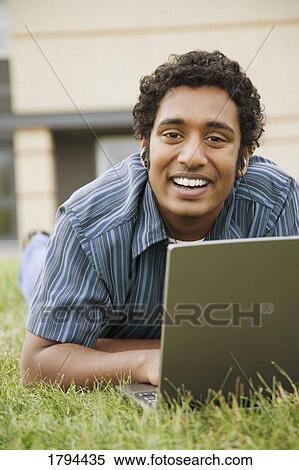 Stock Photography - Man working on a laptop. Fotosearch