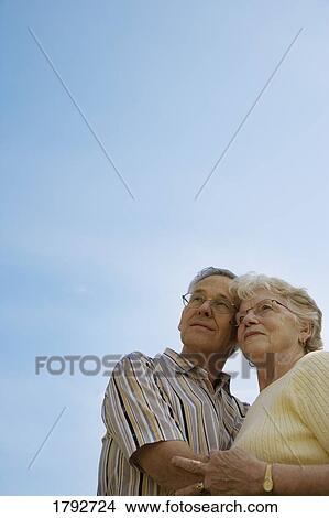 Middle aged couple embracing View Large Photo Image Picture - Middle aged couple embracing. Fotosearch