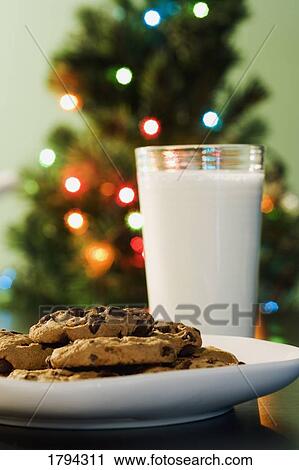 Stock Image - Milk and cookies for Santa. Fotosearch