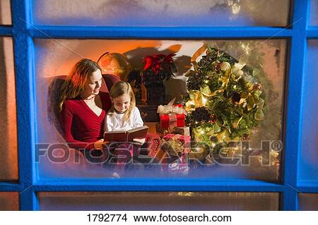 Picture - Mom and child at Christmas. Fotosearch