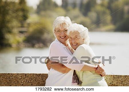 Mother and daughter hugging View Large Photo Image Stock Image - Mother and daughter hugging. Fotosearch