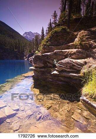 Mountain lake shoreline View Large Photo Image Stock Photograph - Mountain lake shoreline. Fotosearch