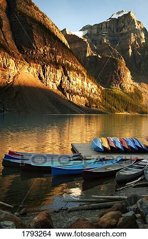 Picture - Mountain lake with canoes. Fotosearch