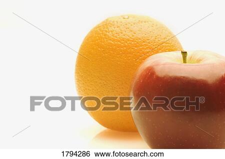 Orange and apple View Large Photo Image Stock Photograph - Orange and apple. Fotosearch