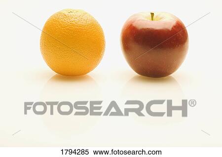 Stock Photography - Orange and apple. Fotosearch