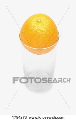 Orange and empty cup View Large Photo Image Stock Image - Orange and empty cup. Fotosearch