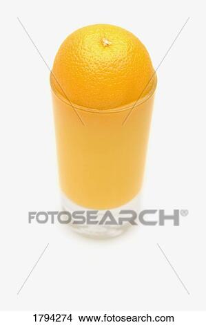 Orange and juice filled glass View Large Photo Image Picture - Orange and juice filled glass. Fotosearch
