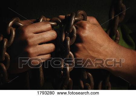 Person bound in chains View Large Photo Image Stock Image - Person bound in chains. Fotosearch