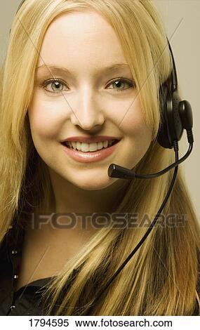 Portrait of a woman with a head set View Large Photo Image Stock Photography - Portrait of a woman with a head set. Fotosearch