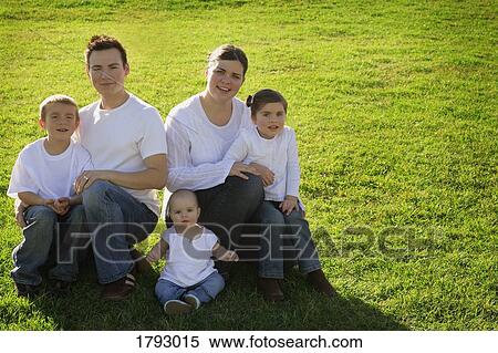 Stock Photography - Portrait of a young family. Fotosearch