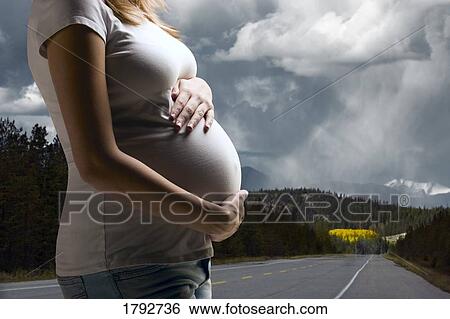 Pregnant woman on road of life View Large Photo Image Stock Photograph - Pregnant woman on road of life. Fotosearch