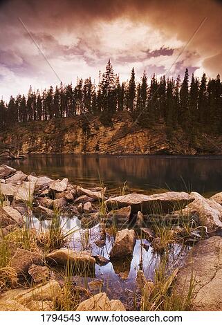 Rocky shoreline of lake View Large Photo Image Stock Image - Rocky shoreline of lake. Fotosearch