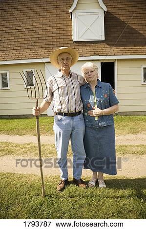 Stock Photo - Senior couple as American Gothic. Fotosearch
