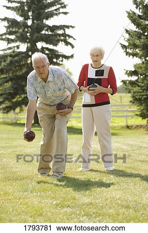 Stock Image - Seniors playing sports. Fotosearch