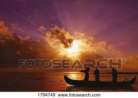 Stock Photo - Silhouetted fishermen. Fotosearch