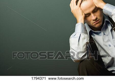 Stock Image - Stressed businessman. Fotosearch