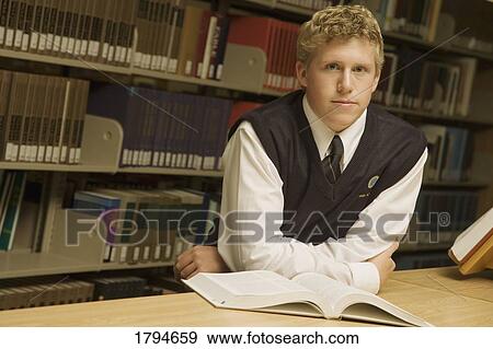 Stock Photo - Student in library. Fotosearch