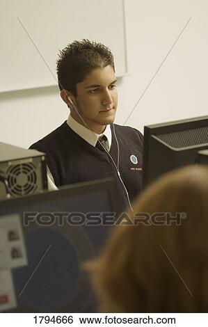 Stock Photograph - Student working on a computer. Fotosearch