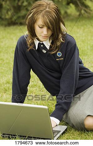 Student working on a laptop View Large Photo Image Stock Image - Student working on a laptop. Fotosearch