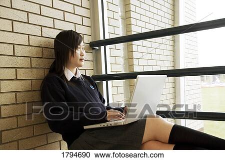 Student working on a laptop View Large Photo Image Stock Image - Student working on a laptop. Fotosearch