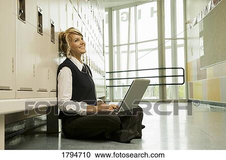 Stock Image - Student working on a laptop. Fotosearch