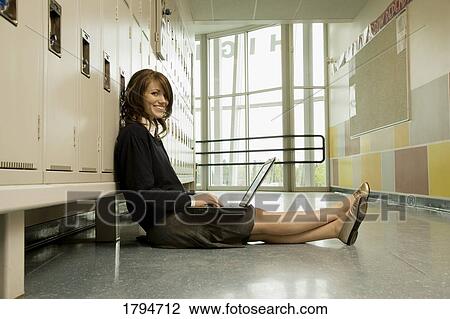 Stock Image - Student working on a laptop. Fotosearch