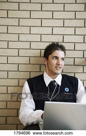 Stock Photograph - Student working on a laptop. Fotosearch