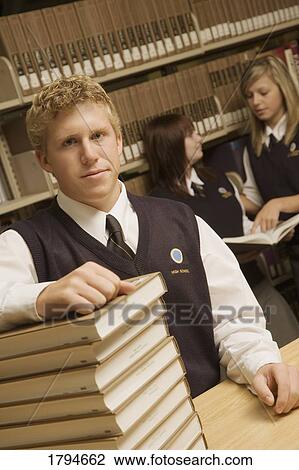 Stock Image - Students in a library. Fotosearch