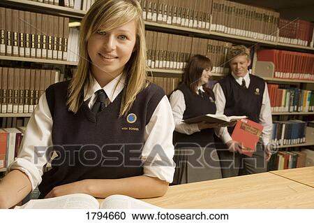 Stock Image - Students in the library. Fotosearch