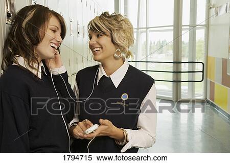 Stock Photography - Students listening to music. Fotosearch
