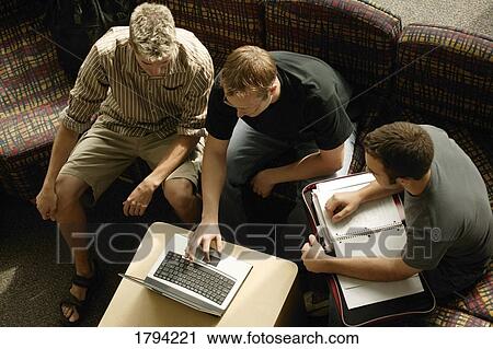 Stock Image - Students working together. Fotosearch