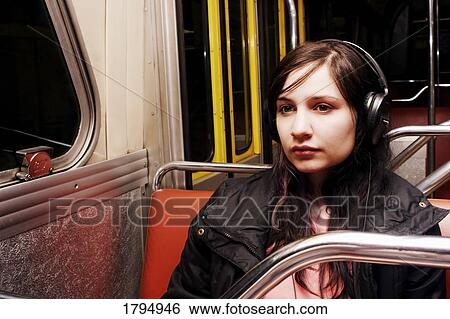 Teen sitting on a bus View Large Photo Image Stock Photograph - Teen sitting on a bus. Fotosearch