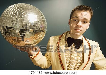 Stock Image - Teen with a mirror ball. Fotosearch