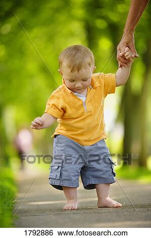 Toddler looking down  View Large Photo Image Stock Photograph - Toddler looking down . Fotosearch