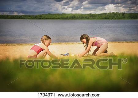 Two girls at the beach View Large Photo Image Stock Image - Two girls at the beach. Fotosearch