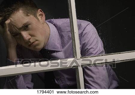 Stock Image - Unhappy man. Fotosearch