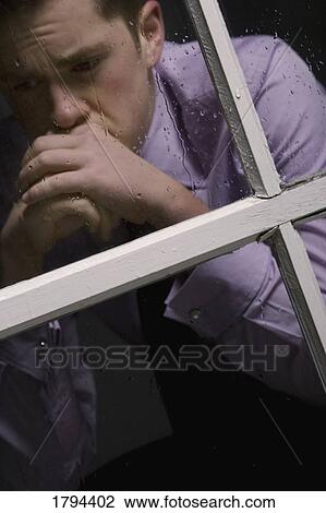 Stock Image - Unhappy man. Fotosearch