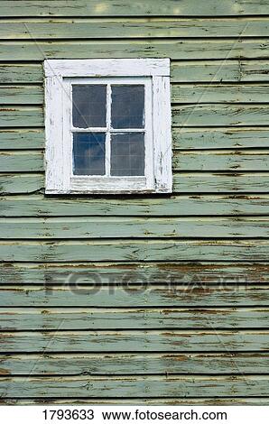 Stock Image - window of a weathered barn. Fotosearch