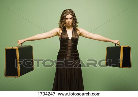 Stock Photo - Woman holding baggage. Fotosearch
