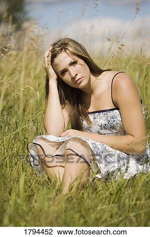 Woman in a field View Large Photo Image Stock Image - Woman in a field. Fotosearch