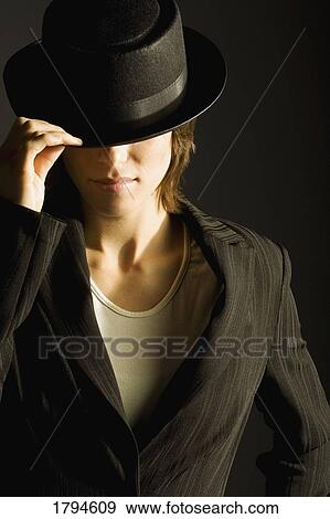 Woman in suit and hat View Large Photo Image Stock Photo - Woman in suit and hat. Fotosearch