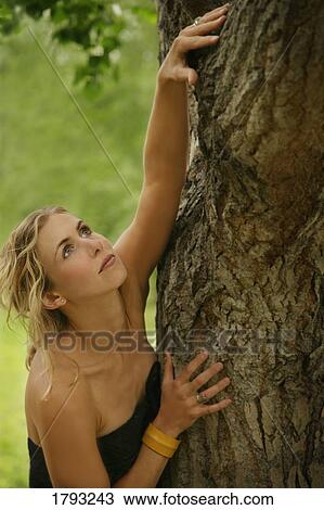 Stock Image - Woman reaching upwards. Fotosearch