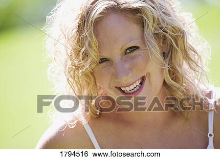 Woman smiles View Large Photo Image Stock Photograph - Woman smiles. Fotosearch